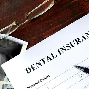 A dental insurance form on top of a desk.