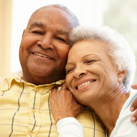 A man and woman smiling for the camera.