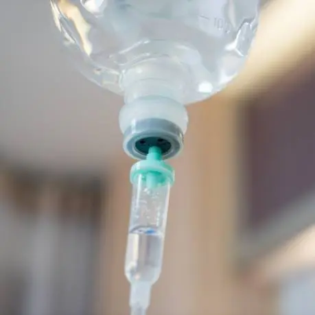 A close up of an injection needle in a bottle